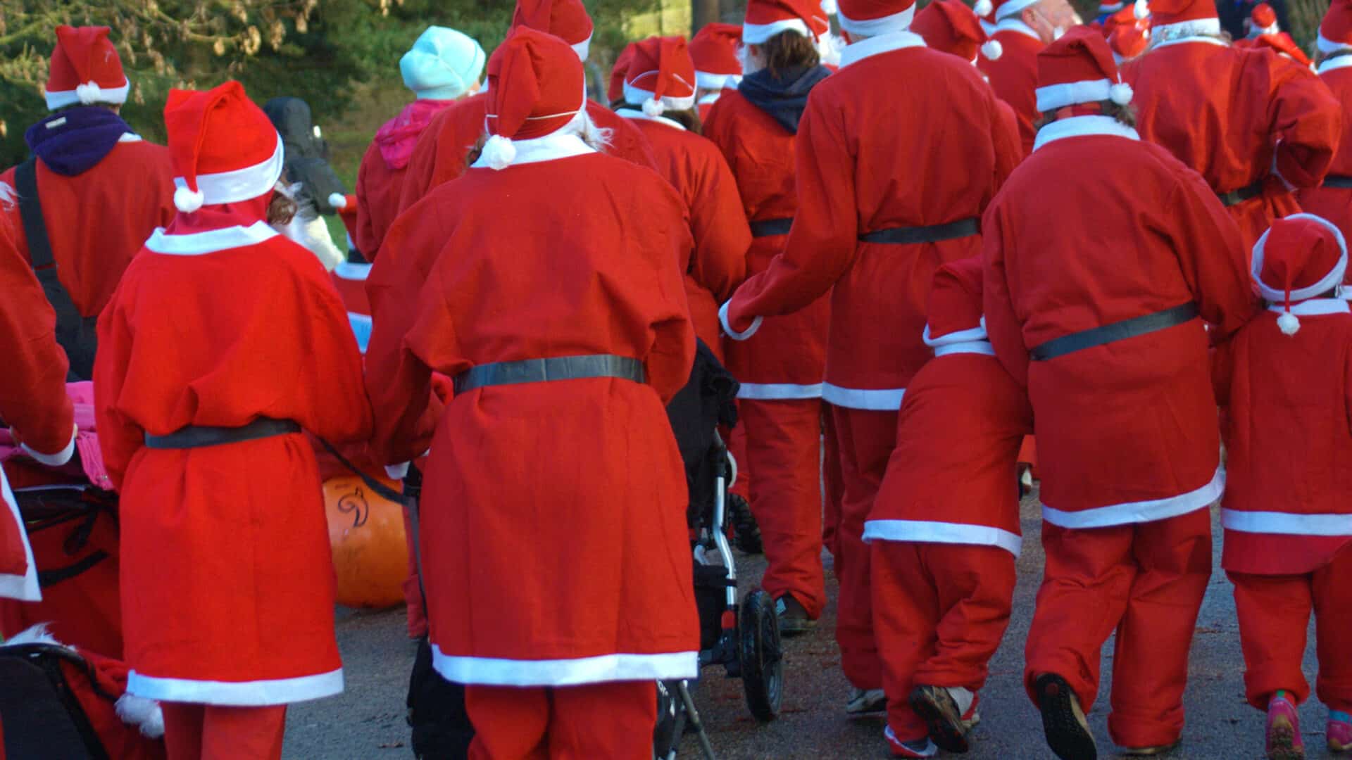 group of santas runing