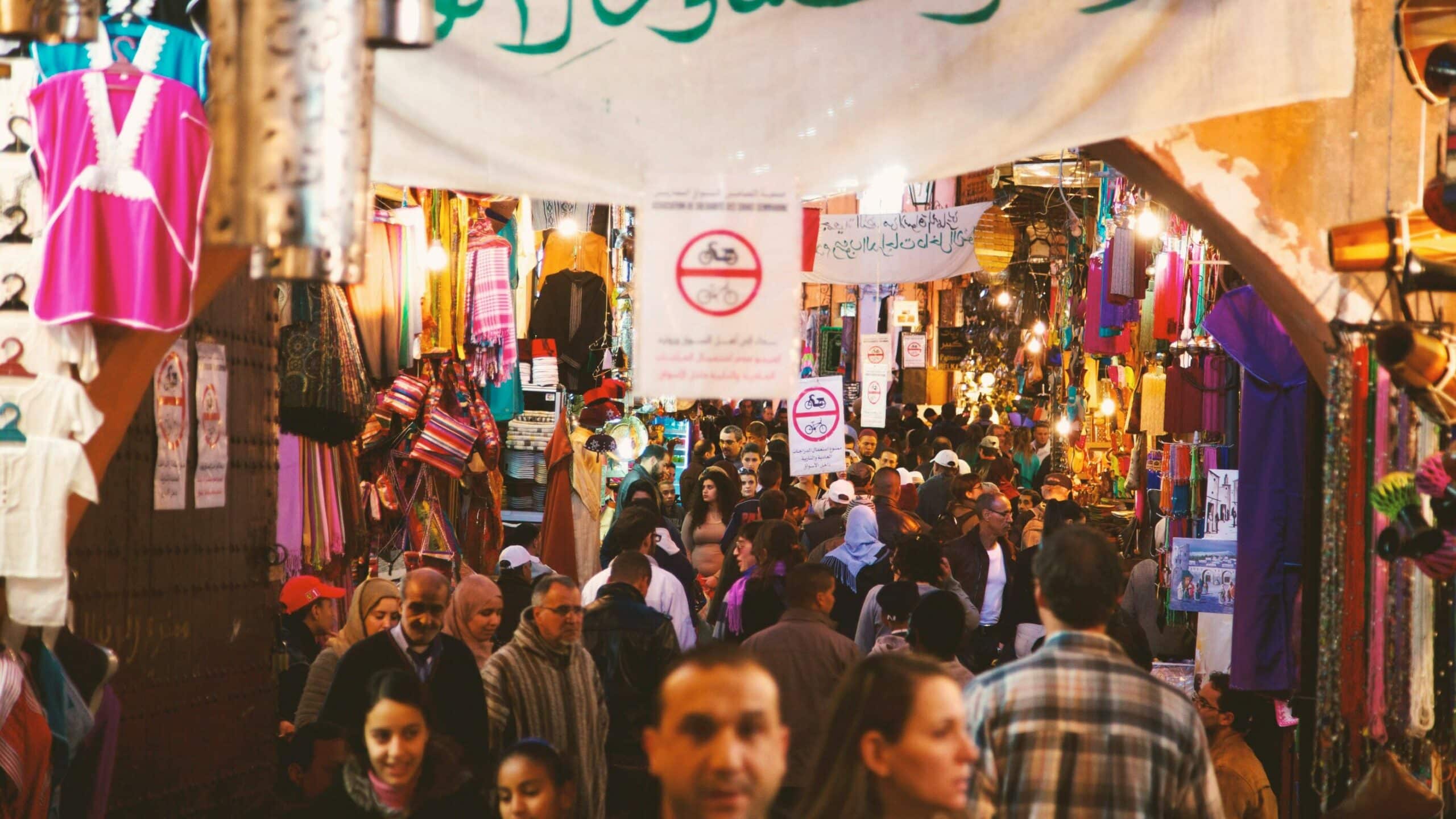 A picture of a densely packed crowd in a Middle Eastern market, used to convey the immense size of our global population on World Population Day
