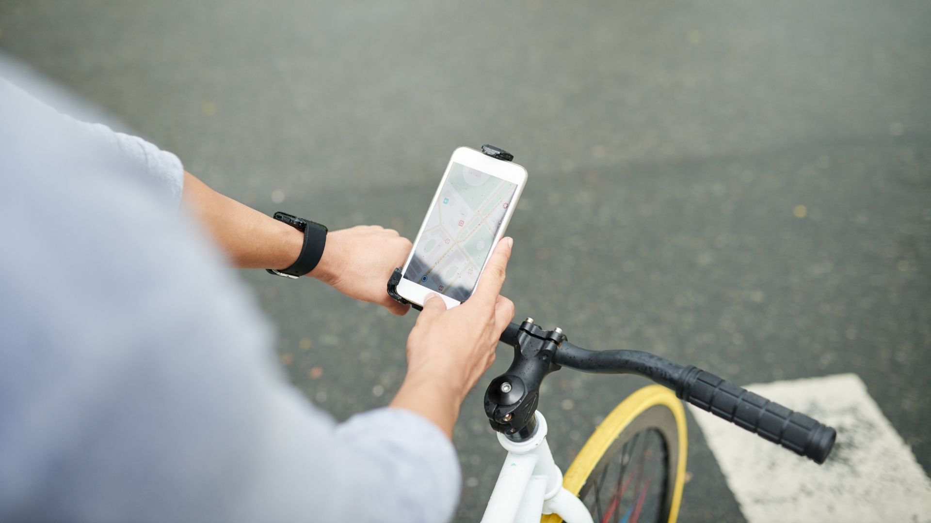 A person on a bicycle looking at their satnav