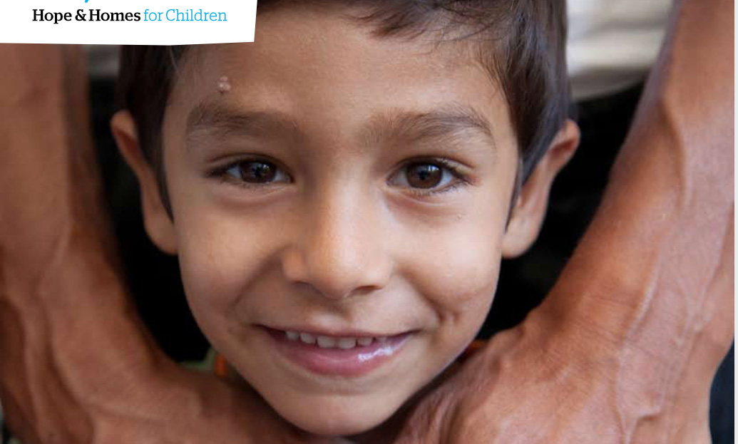 Report cover showing a young Bosnian boy's smiling face