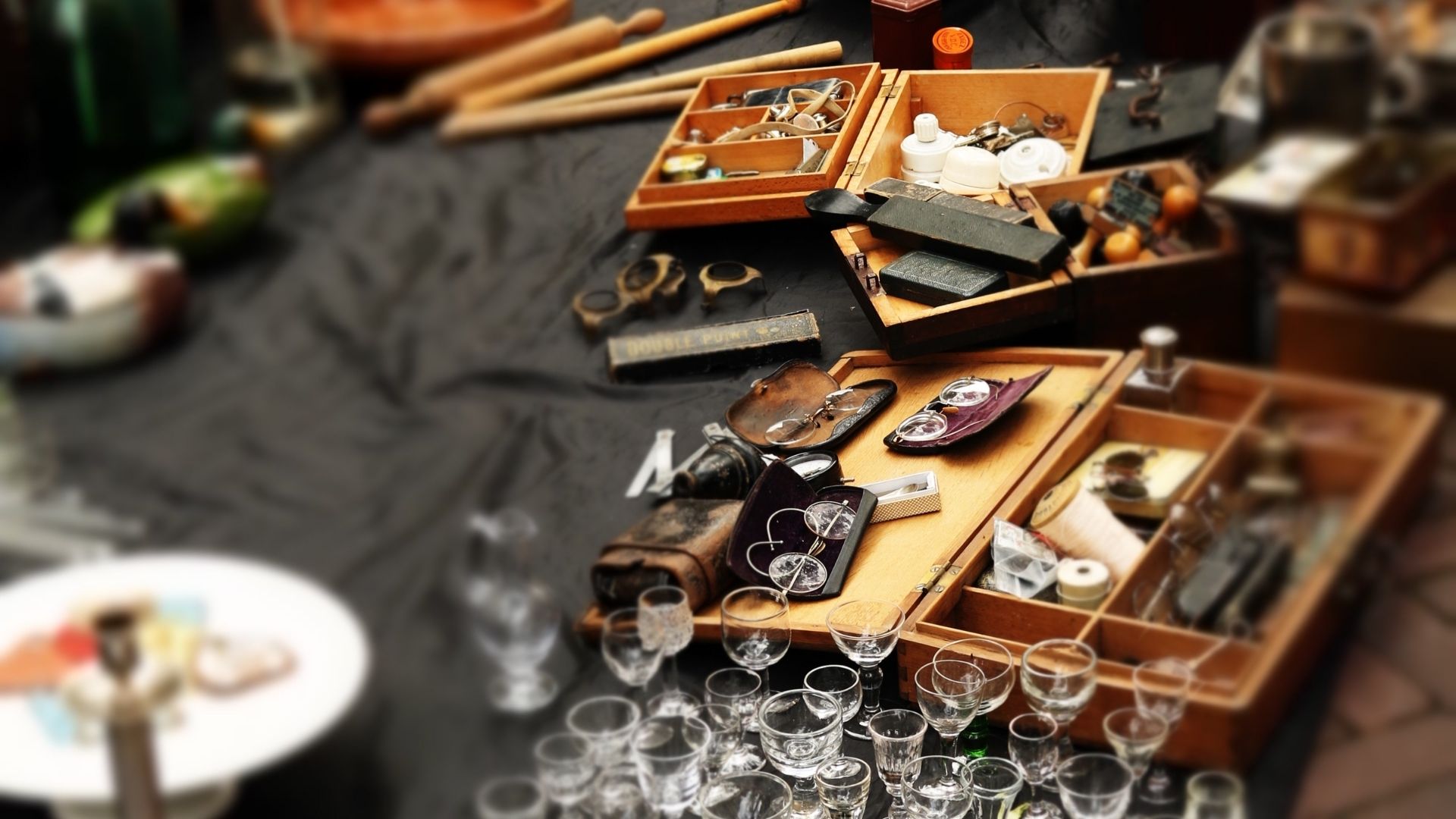 Piles of knick knacks for sale on a table