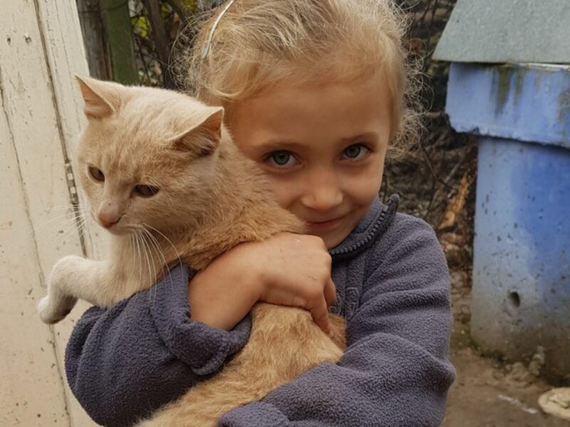 Violeta, a Moldovan child we have worked with in our programmes alongside CCF Moldova, with her cat