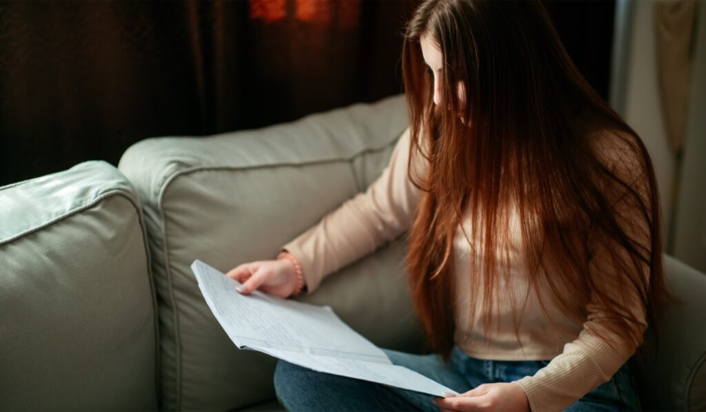 Image: Daryna studying inside her new room, shared with three friends, in Bucharest.