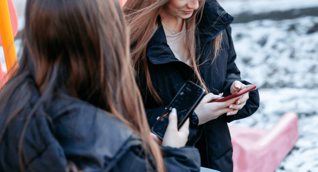 Daryna smiling, alongside her friend at the emergency child protection centre.