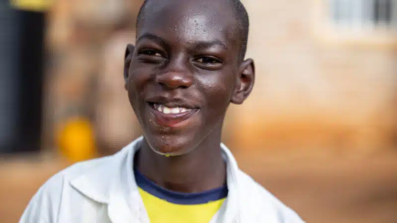 Image is of a young man, Peter, smiling